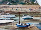many boats that are sitting in the water by the shore