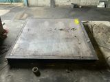 a metal tray that is sitting on the ground