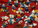 a lot of smurfs that are on the table