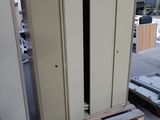 two metal cabinets in a warehouse with pallets on the floor