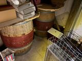 a stack of books on top of a wooden barrel
