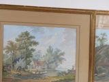 two framed paintings of a river scene with a house in the distance