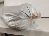 a bag of food sitting on a counter in a kitchen