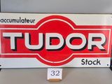 a red and white sign that says tudor on it