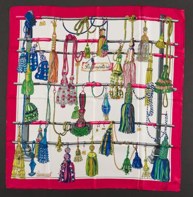 a picture of a colorful scarf with tassels on it