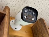 a camera that is sitting on a wooden shelf