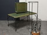 a small table with a basket on top of it next to a small table with a basket on it