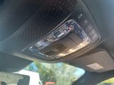 a close up of a car ' s dashboard with the sunroof