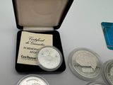 a box of silver coins with a card in it
