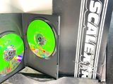 two dvd ' s sitting on top of a black case