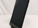 a tablet that is sitting on a stand on a white surface