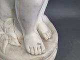 statue of a dog on a pedestal on a gray background