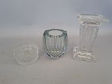 three glass vases sitting next to each other on a table