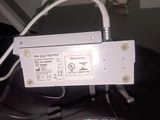 a close up of a white electronic device on a table
