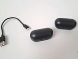 two usb drives connected to each other on a white surface