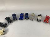 several toy cars are arranged in a circle on a white surface