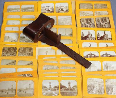 an old photo of a hammer on top of a pile of old photos