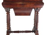 an old wooden table with a drawer on top of it