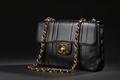 a chanel black leather shoulder bag with gold hardware
