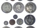 an image of a bunch of coins sitting on top of a white surface