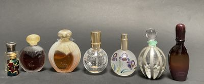several different types of perfume bottles lined up in a row