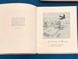 a book open on a table with a picture of a bird on it