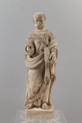 an old statue of a woman holding a baby in her arms