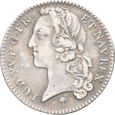 gros plan d'une pièce de monnaie sur laquelle figure un visage de femme
