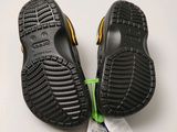 two pairs of children ' s shoes are on a white surface