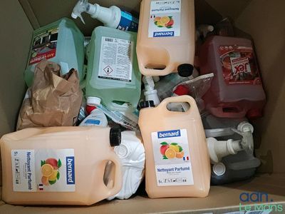 a cardboard box filled with different types of cleaning products