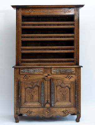 an old wooden cabinet with two drawers and a door