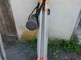 a pole that is leaning against the wall