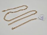 a gold chain with a tag attached to it
