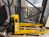 a pallet with a fork on a pallet in a warehouse