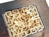 a wooden box with a carved design on it