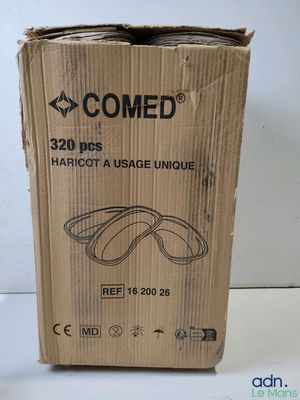 an open cardboard box with a pair of glasses on top of it