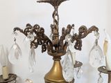 a chandelier that has a bunch of crystal hanging from it