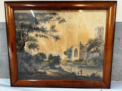 tableau encadré représentant un paysage avec un château en arrière-plan