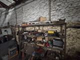 a room that has a bunch of tools on the shelves