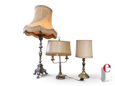 two lamps and a lamp shade on a table