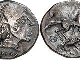 a silver coin with an image of a man riding a horse