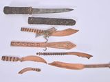 five different types of knifes on a white surface
