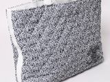 an image of a white and black bag on a white background