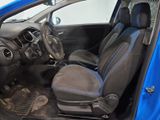 the interior of a small blue car with the door open