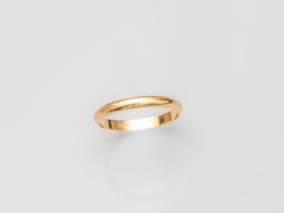 a gold ring on a white background