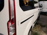 a white van that is parked next to a white van