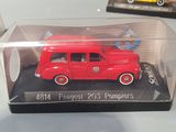 two toy cars in a clear box on a table