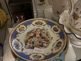 a plate with a picture on it sitting on a table