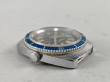 a silver watch with a blue bezel on it