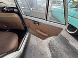 a view of a car with the door open and the driver ' s seat up